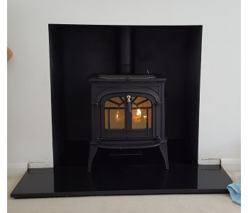 Vermont Intrepid 2 Catalytic Wood Stove - in classic black with a black polished granite hearth. Installed in Guildford, Surrey